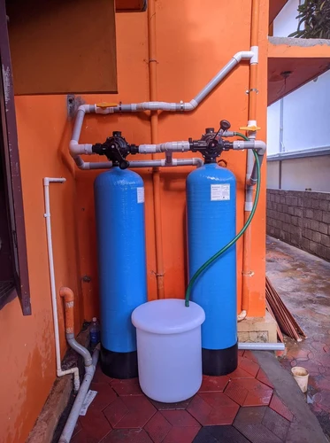 Modern water softener system installed in a residential utility room